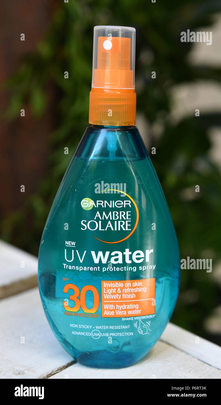 A bottle of a new water based Sun protection fluid from Garnier Ambre  Solaire, in Finsbury central London, at its launch with Davina McCall Stock  Photo - Alamy