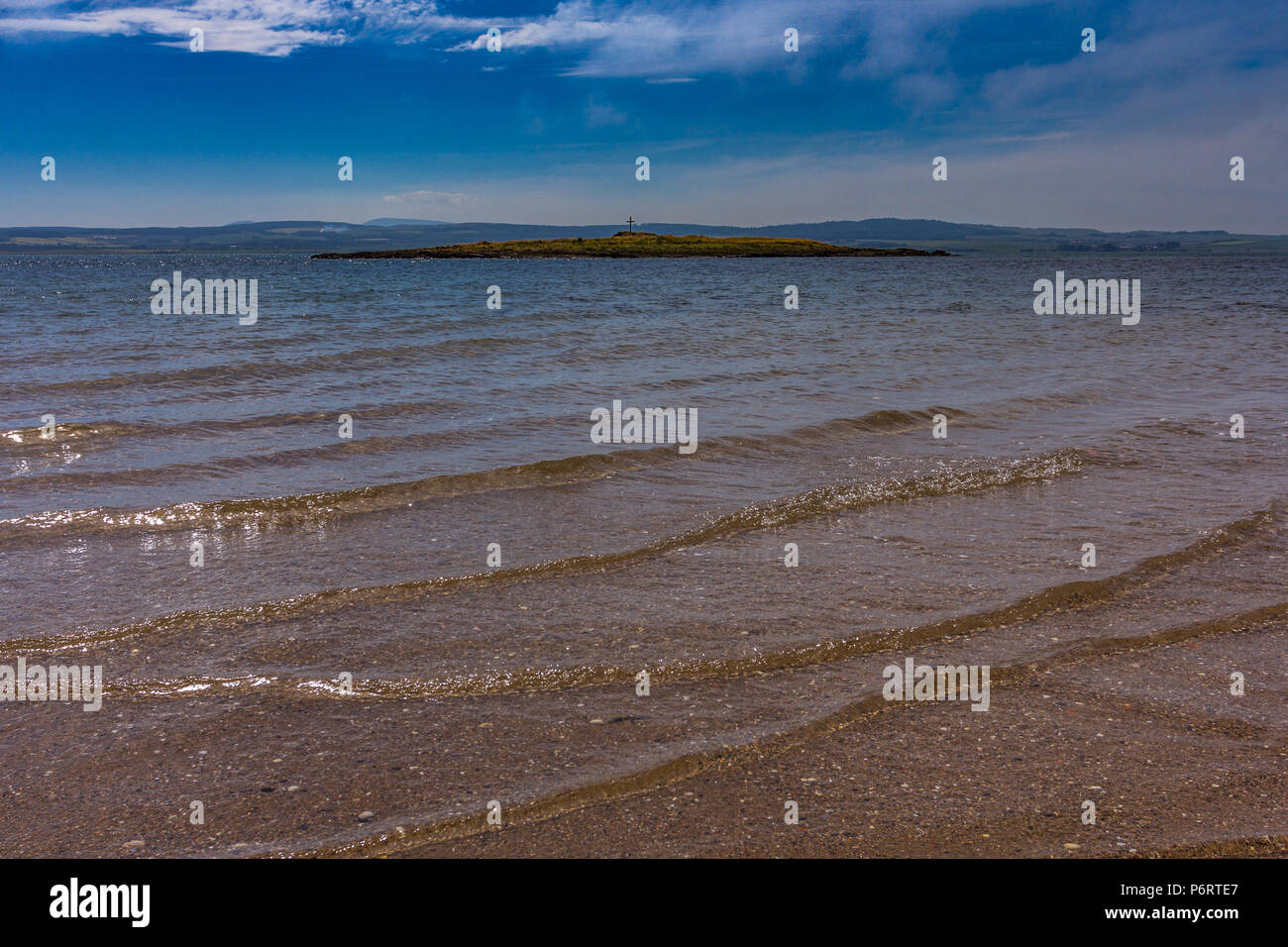 The Holy Island of Lindisfarne, Northumberland, England, looking across to St. Cuthbert’s Island at high tide Stock Photo