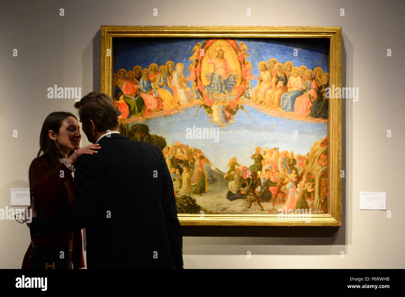Visitors greet beside The Last Judgement by Zanobi Strozzi, during a photocall for Christie's classic week sales, in London. Stock Photo
