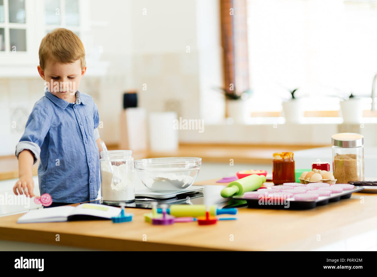 Adorable child making cookies Stock Photo - Alamy