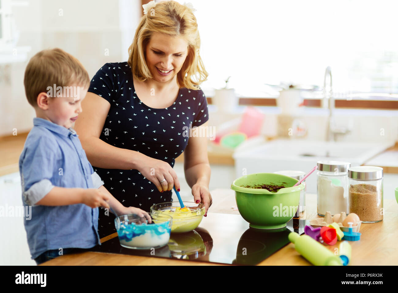 Beautiful child and mother baking Stock Photo Alamy