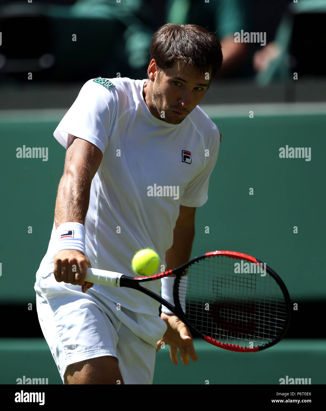 Dusan Lajovic on day One of the Wimbledon Championships at the All England Lawn Tennis and Croquet Club, Wimbledon. Stock Photo