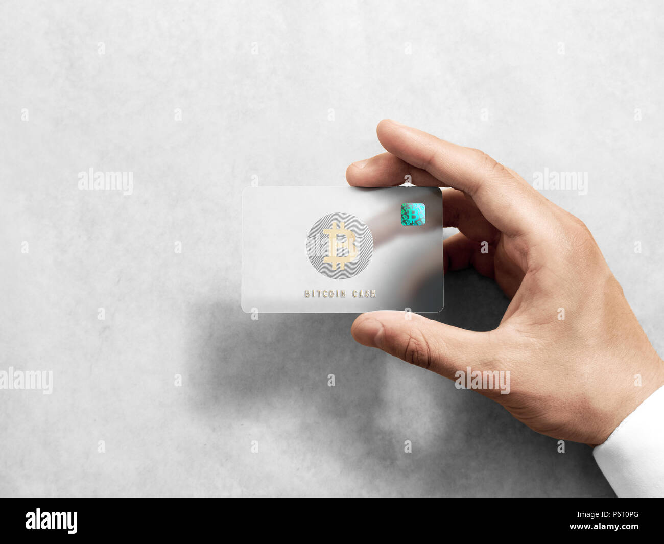 Hand holding bitcoin card template with rounded corners and embossed gold  logo. Plain plastic cryptocurrency payment-card display front, design mock  up. Electronic mining with hologram template Stock Photo - Alamy