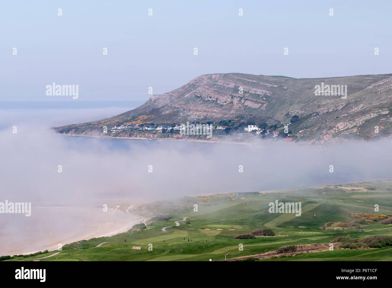 The Great Ormes Head and sea mist at Llandudno on the North Wales coast Stock Photo