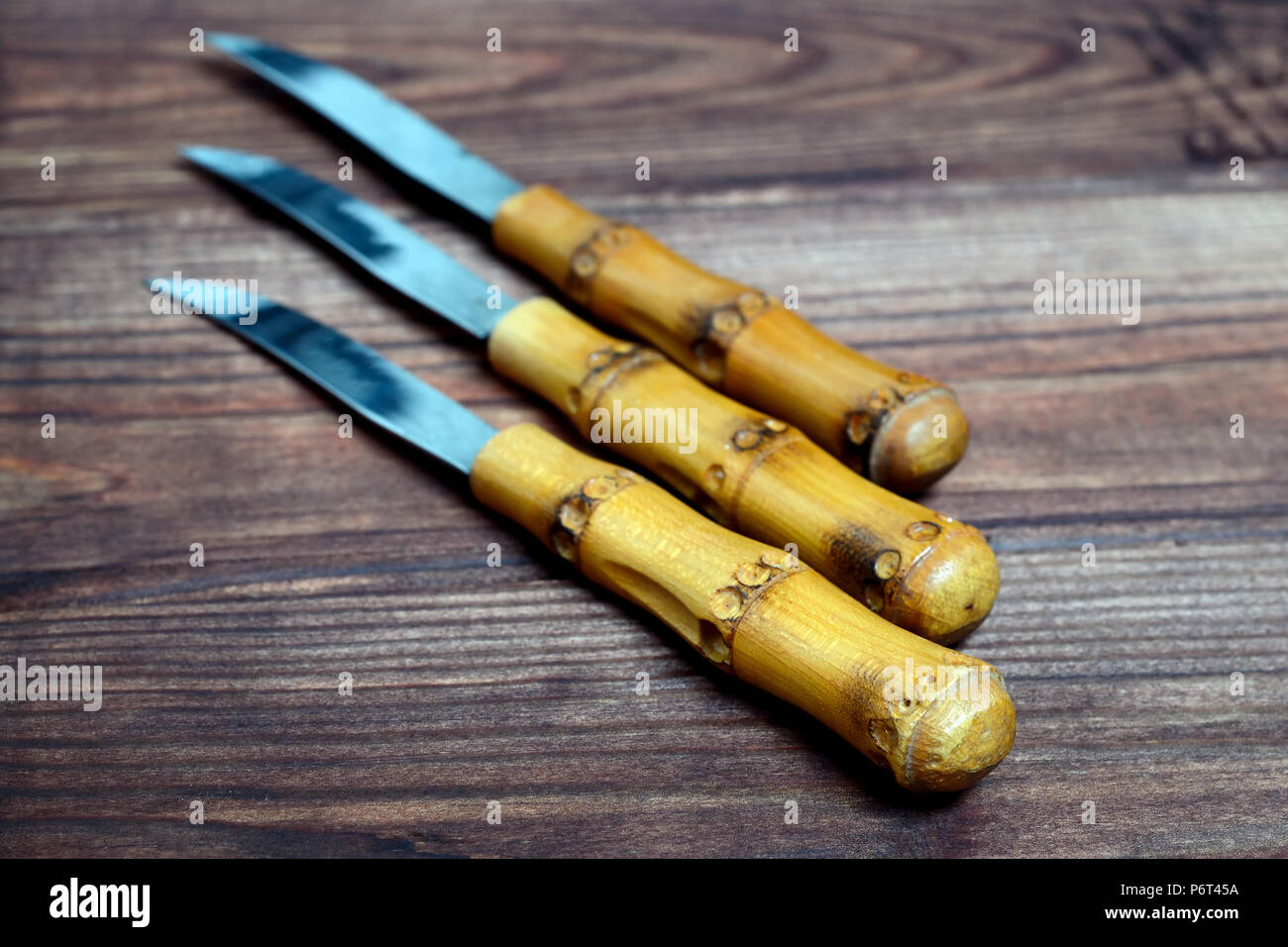 Set of decorative knives with wooden handles Stock Photo Alamy