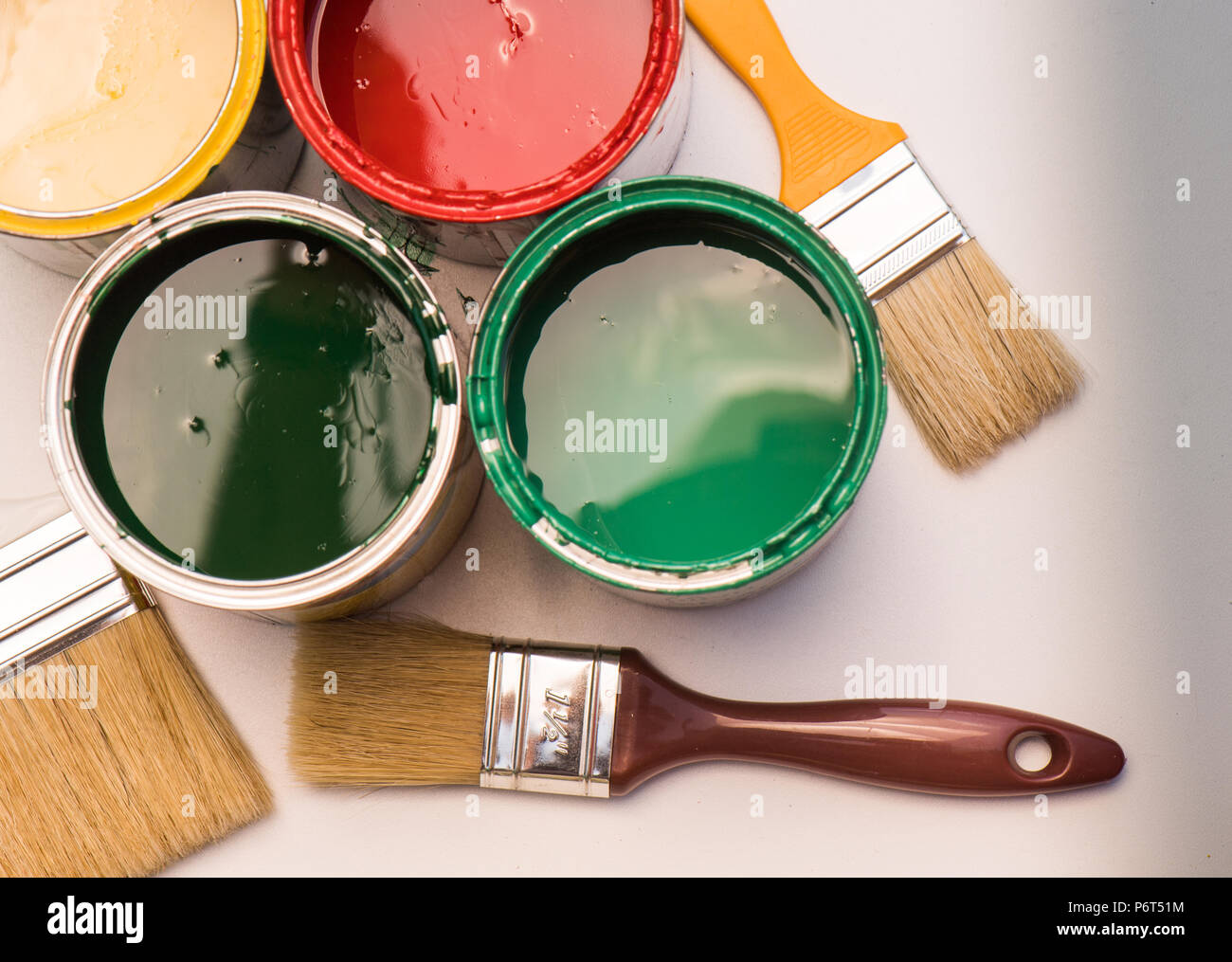 Paint brushes and opened paint cans with colors Stock Photo Alamy