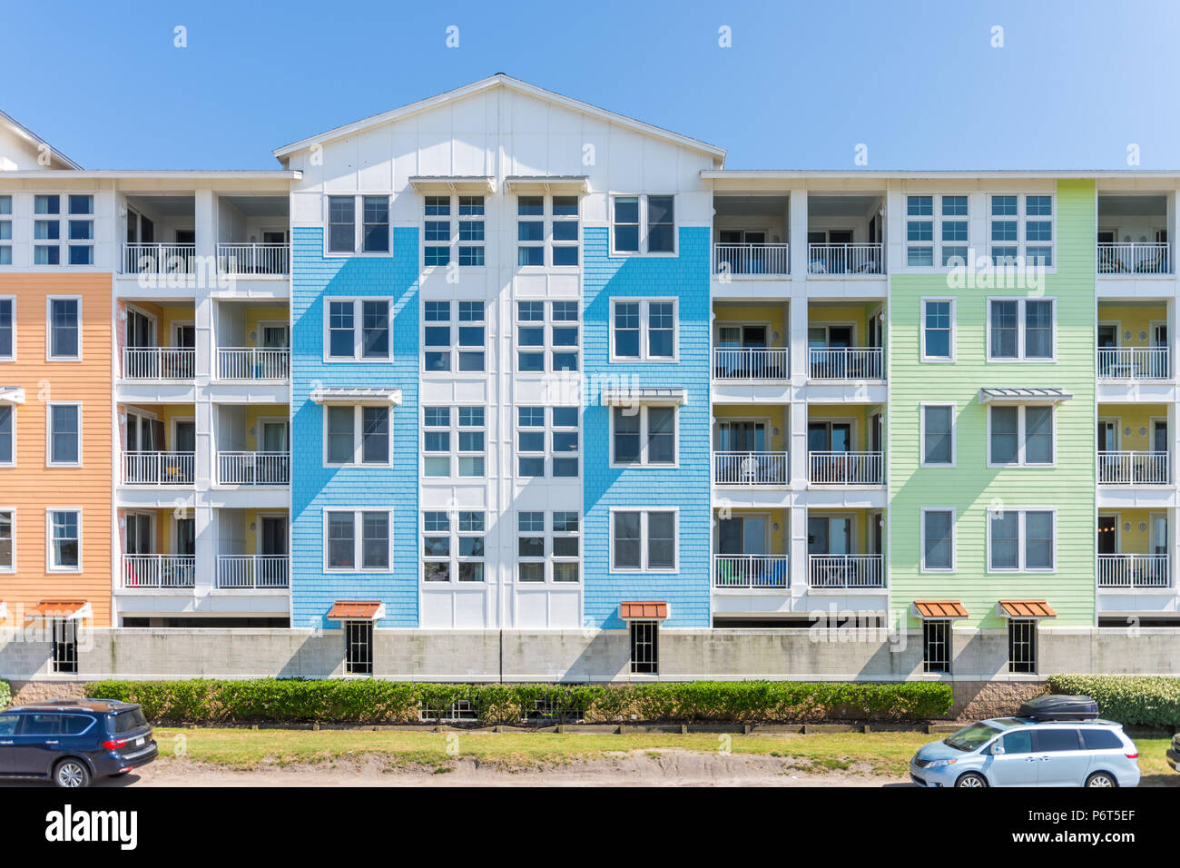 View of high rise apartment or condominium building, bright colors