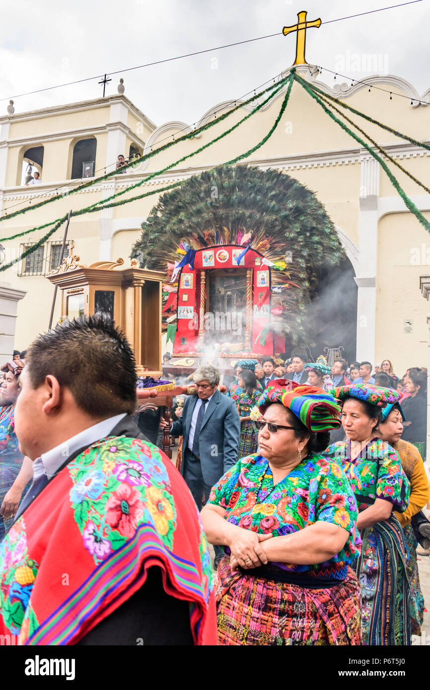 Parramos, Guatemala - December 28, 2016: Traditionally dressed locals participate in religious procession near UNESCO World Heritage Site of Antigua Stock Photo