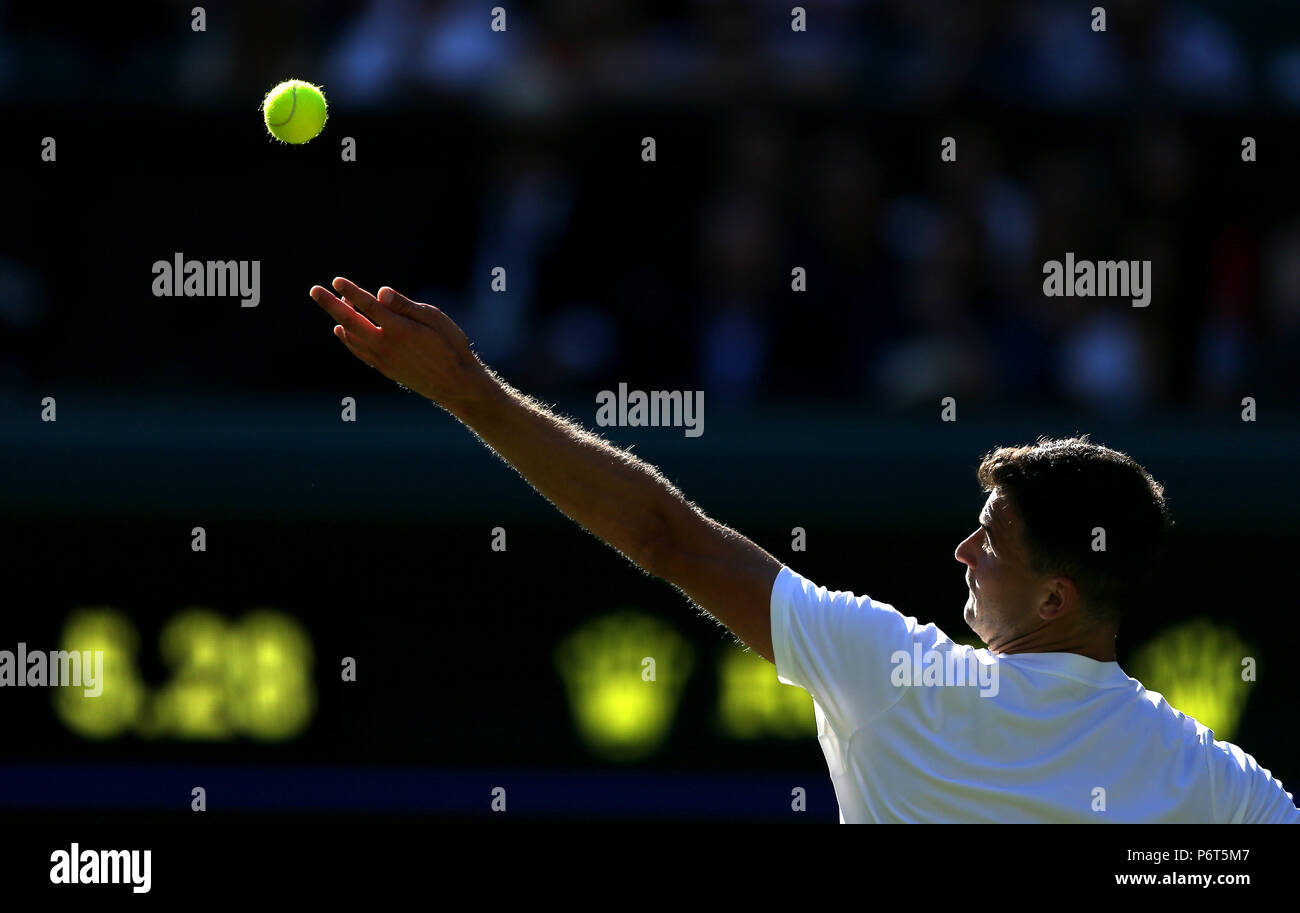 Grigor Dimitrov Serves on day One of the Wimbledon Championships at the All England Lawn Tennis and Croquet Club, Wimbledon. Stock Photo