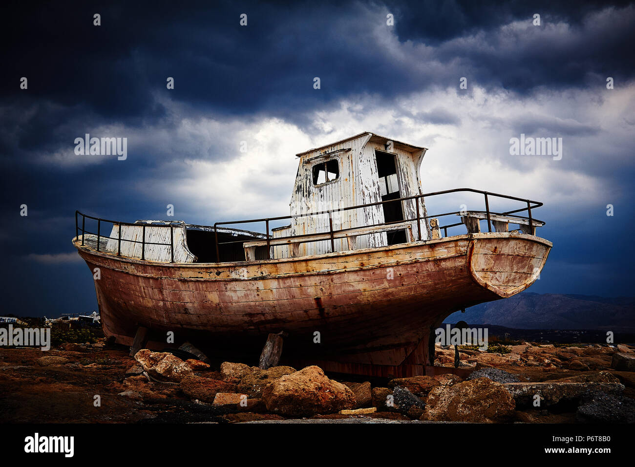 Boat on the rocks Stock Photo - Alamy