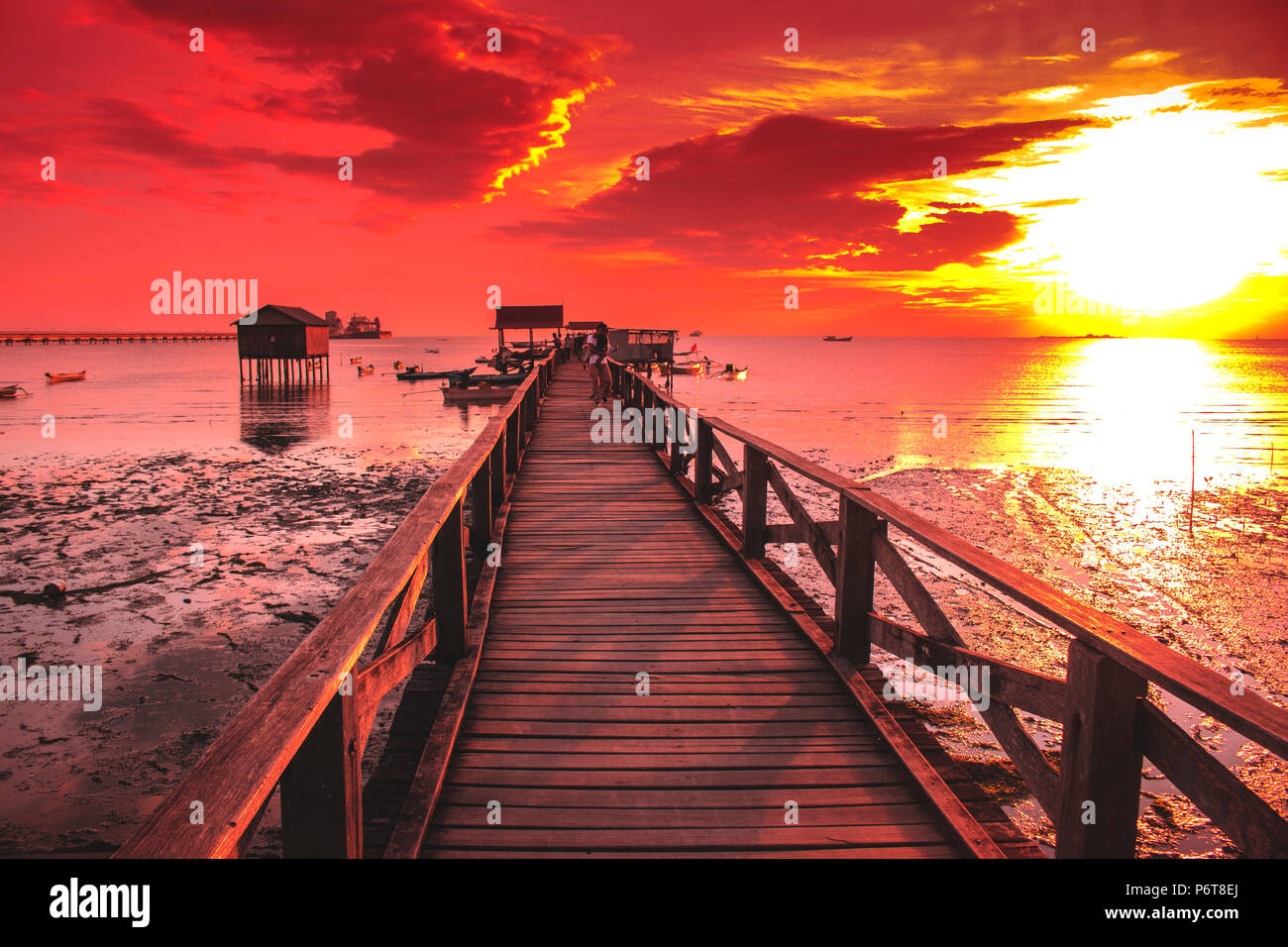 The sun sets with the orange sky color and the calm sea water Stock ...