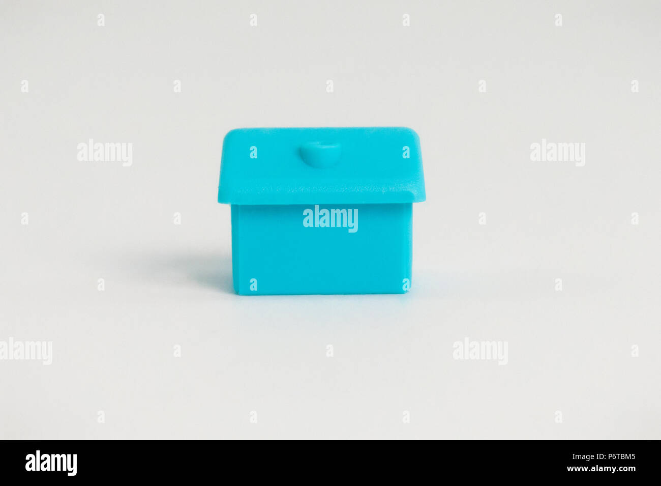 small blue house on a white background Stock Photo