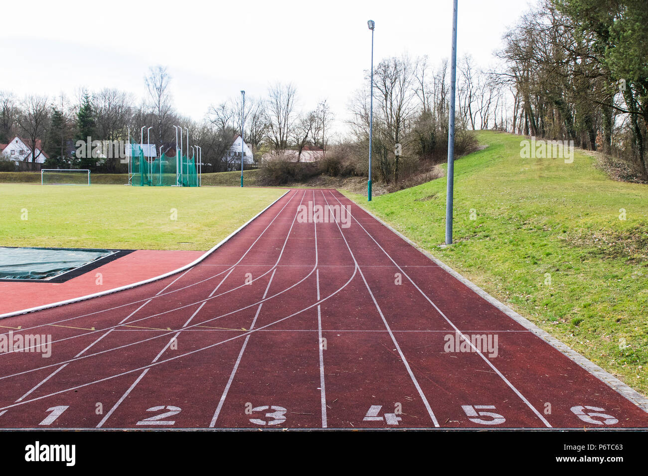 red rubber racetracks in outdoor stadium Stock Photo - Alamy