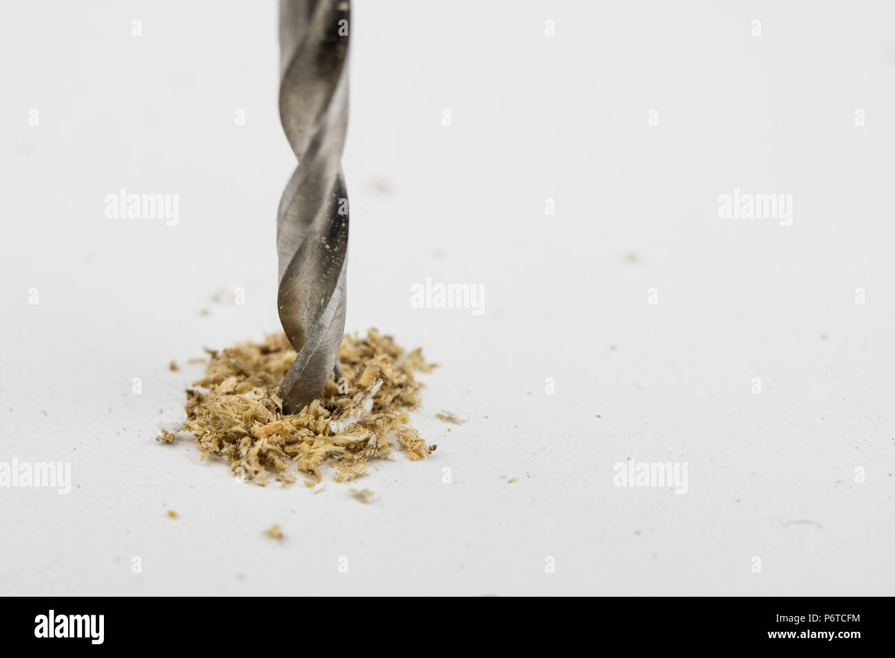 Drilling holes in chipboard. Joinery accessories used in the