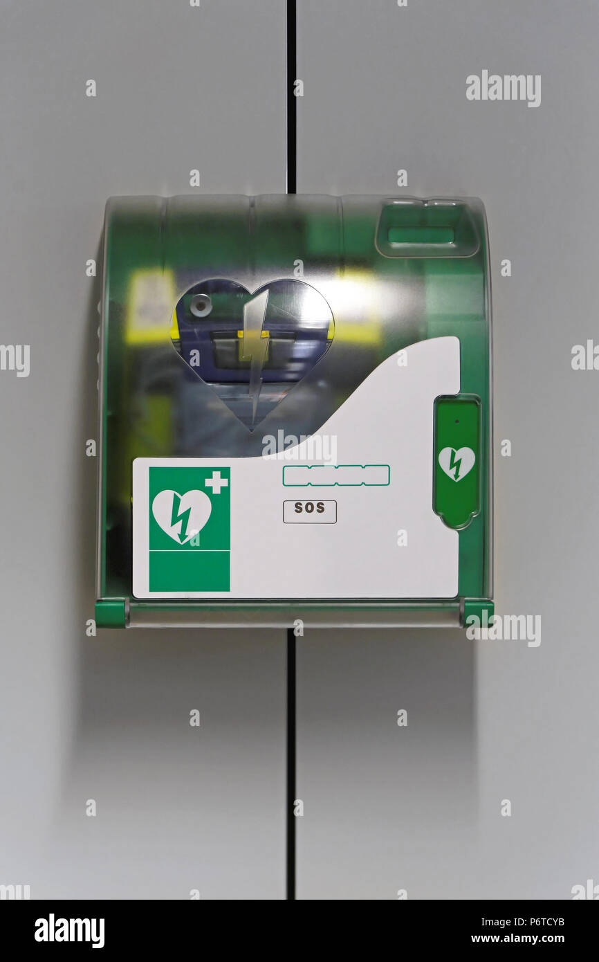 Automated external defibrillator emergency device at wall Stock Photo