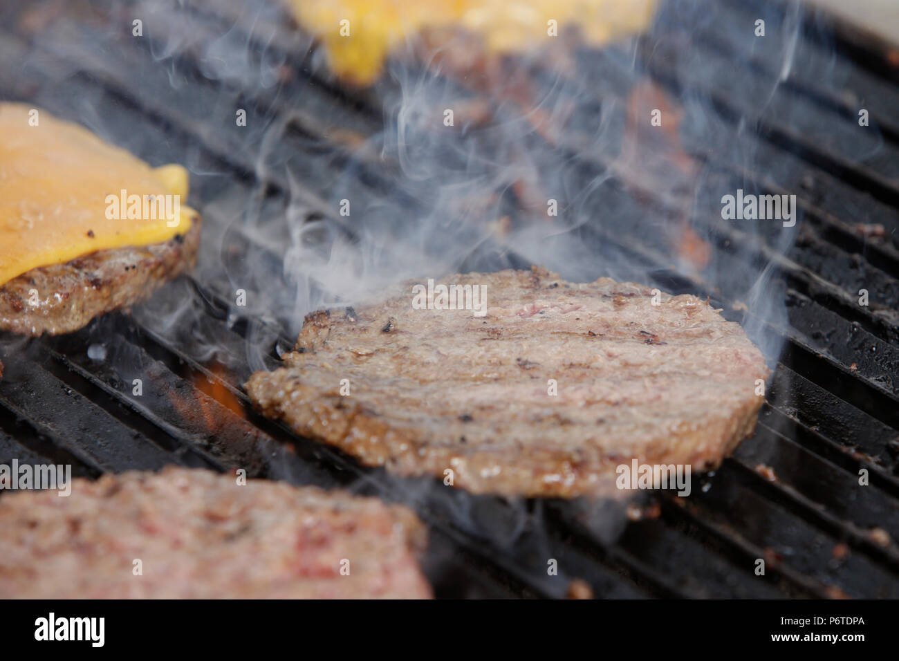Hoppegarten, Germany, Hamburgers are cooked on a grill Stock Photo
