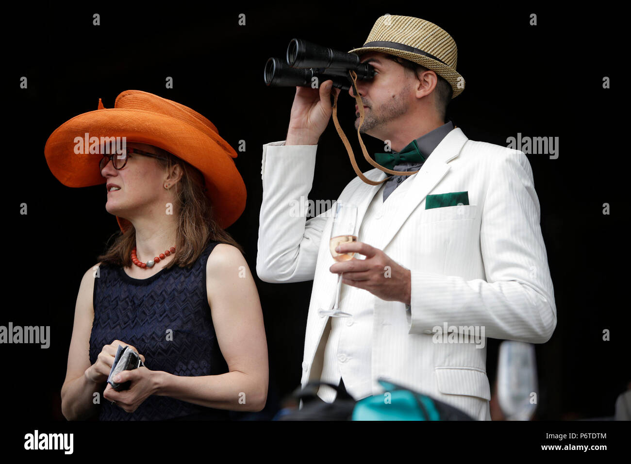 Dresden, racetrack visitor looks through his binoculars Stock Photo