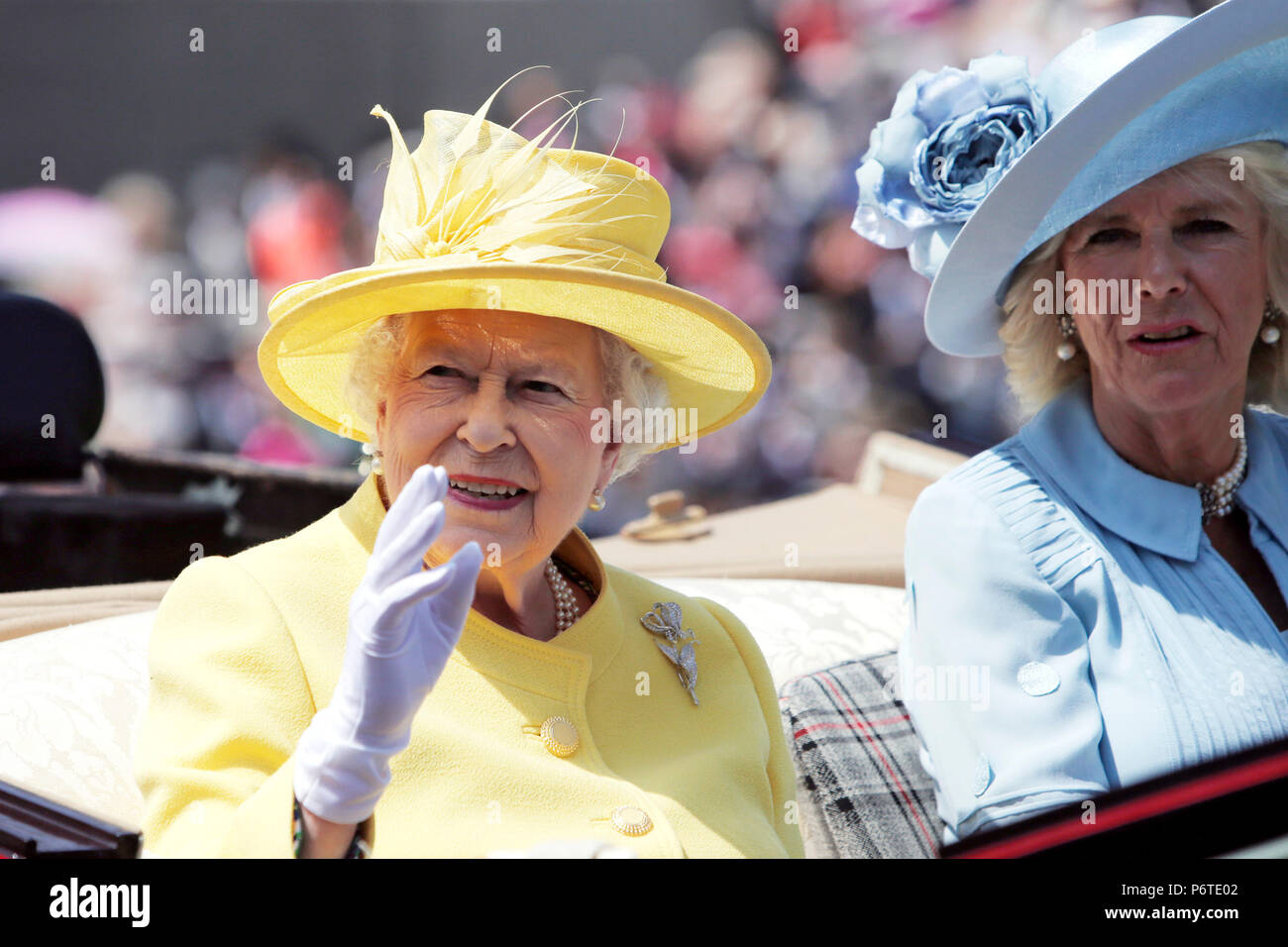 Royal Ascot, Royal Procession. Queen Elizabeth the Second and Camilla Mountbatten-Windsor arriving at the racecourse Stock Photo