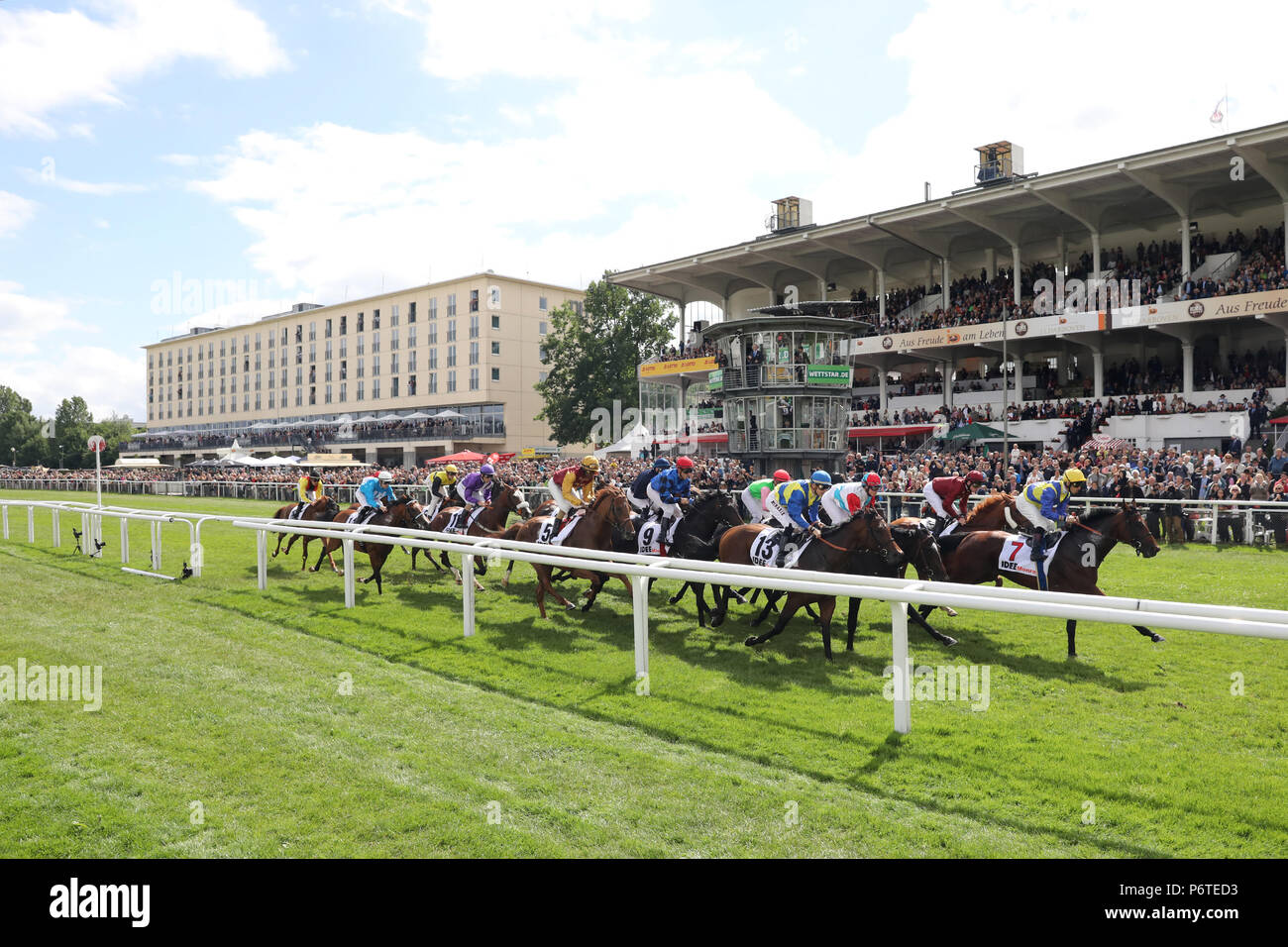 Hamburg, horses and jockeys in the 148th IDEE German Derby in front of the Tribune Stock Photo