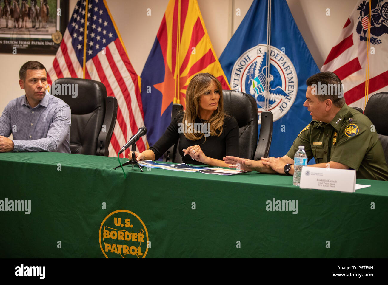 U.S. First lady Melania Trump listens to Rodolfo Karisch, right, Chief Patrol Agent, TCA Border Patrol during a roundtable discussion on immigrant children that have been separated form their parents June 28, 2018 in Tuscon, Arizona. U.S. Customs and Border Protection Commissioner Kevin McAleenan looks on from the left. Stock Photo
