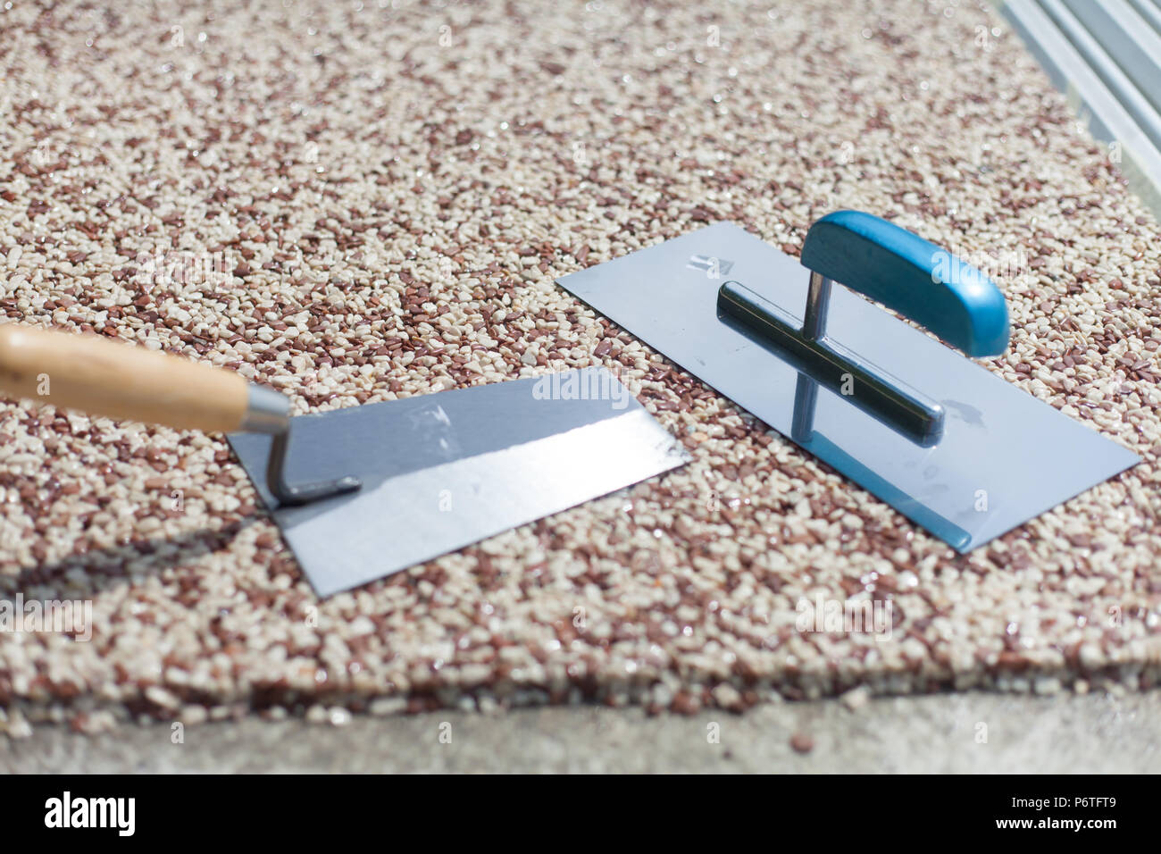 Coloured Concrete Around Pool with tools Stock Photo
