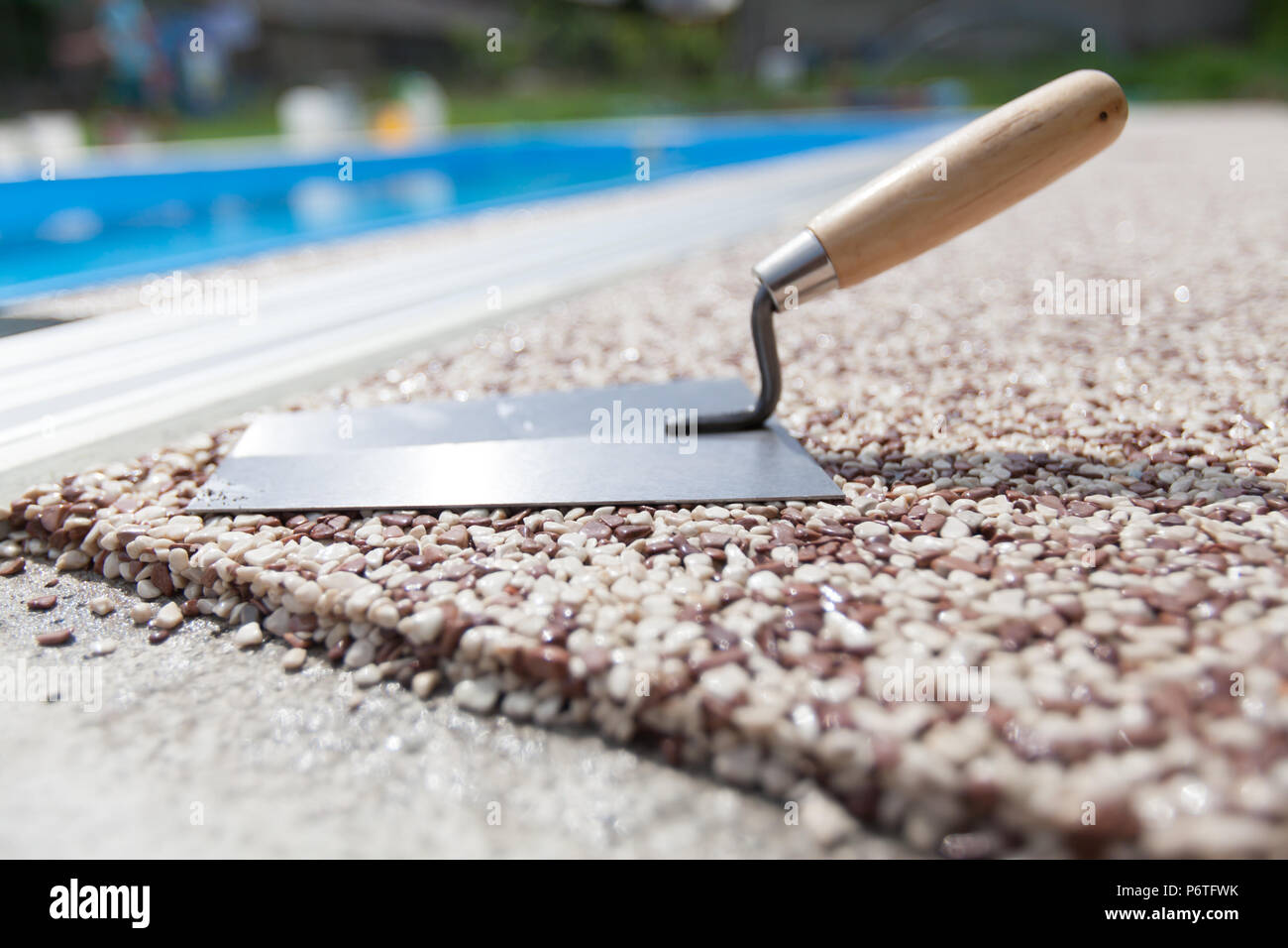 Coloured Concrete Around Pool with tools Stock Photo