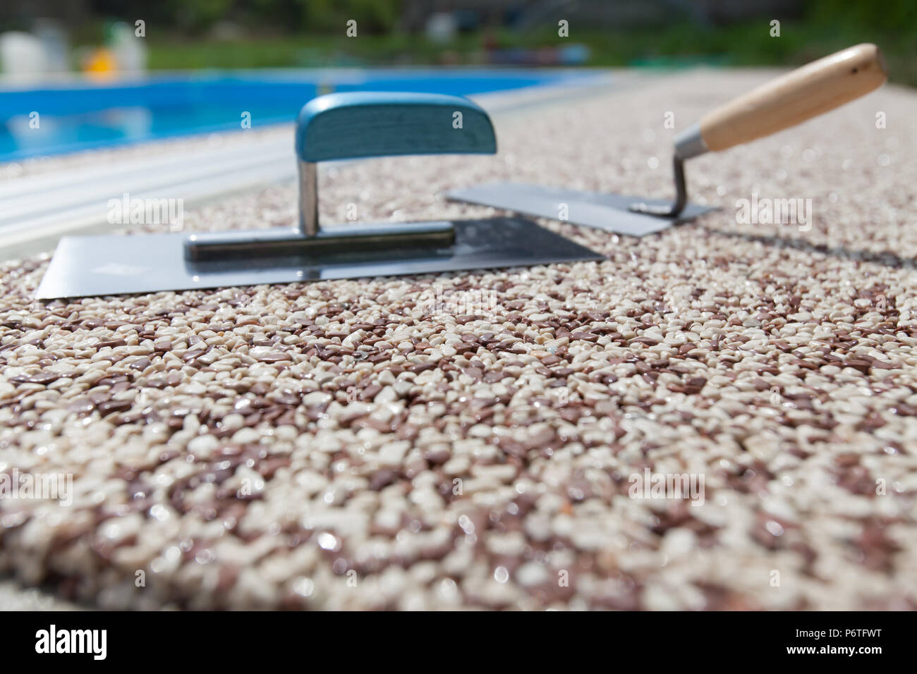 Coloured Concrete Around Pool with tools Stock Photo