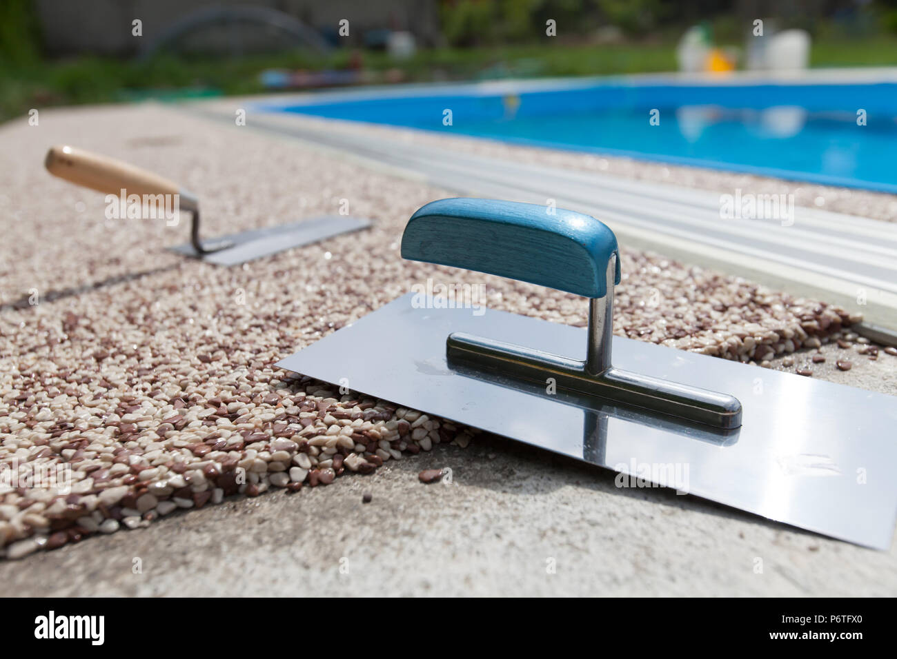 Coloured Concrete Around Pool with tools Stock Photo