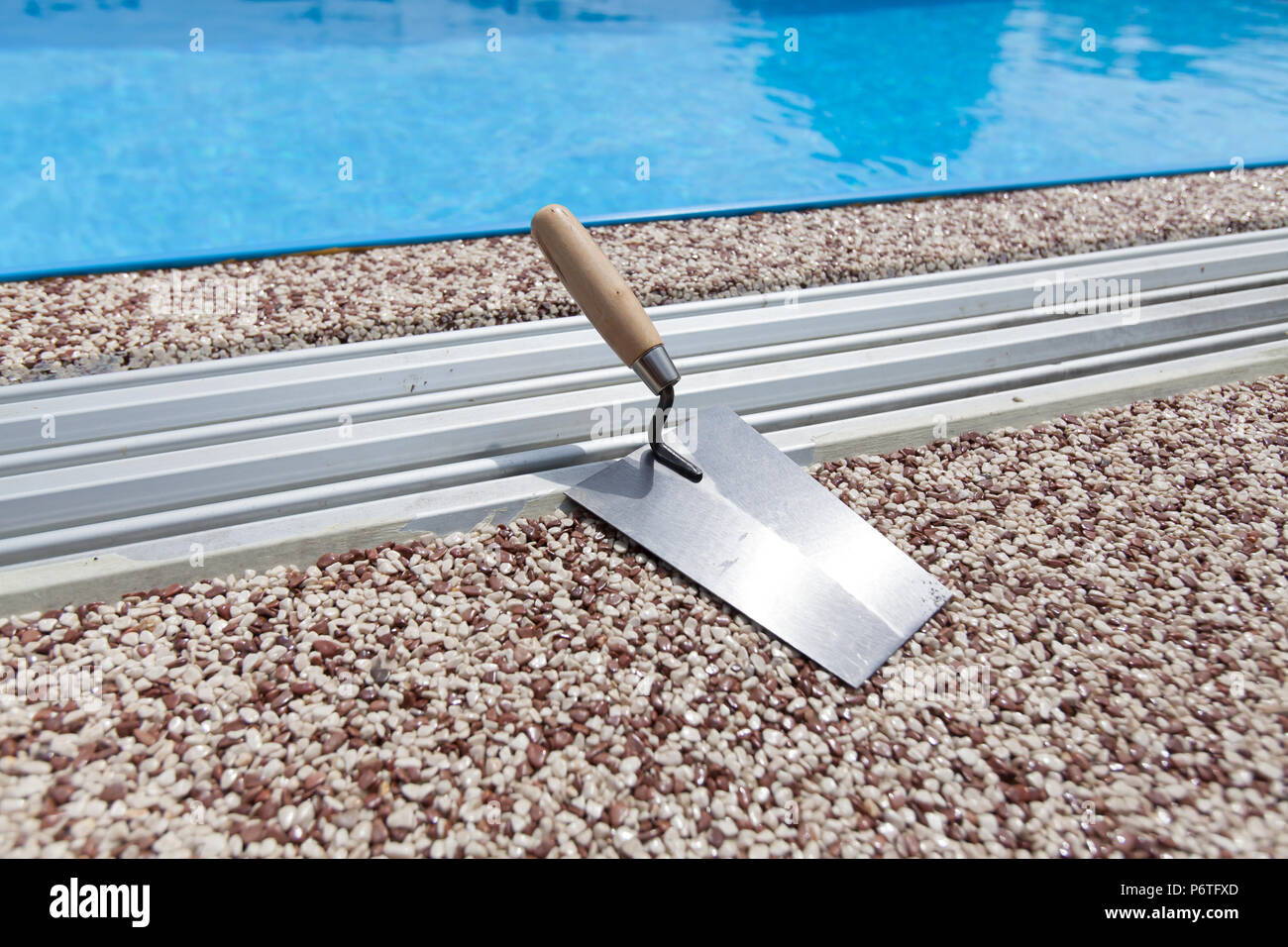 Coloured Concrete Around Pool with tools Stock Photo