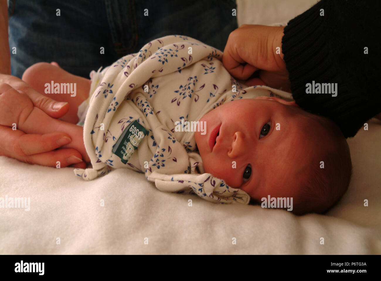 Newborn baby being changed Stock Photo Alamy