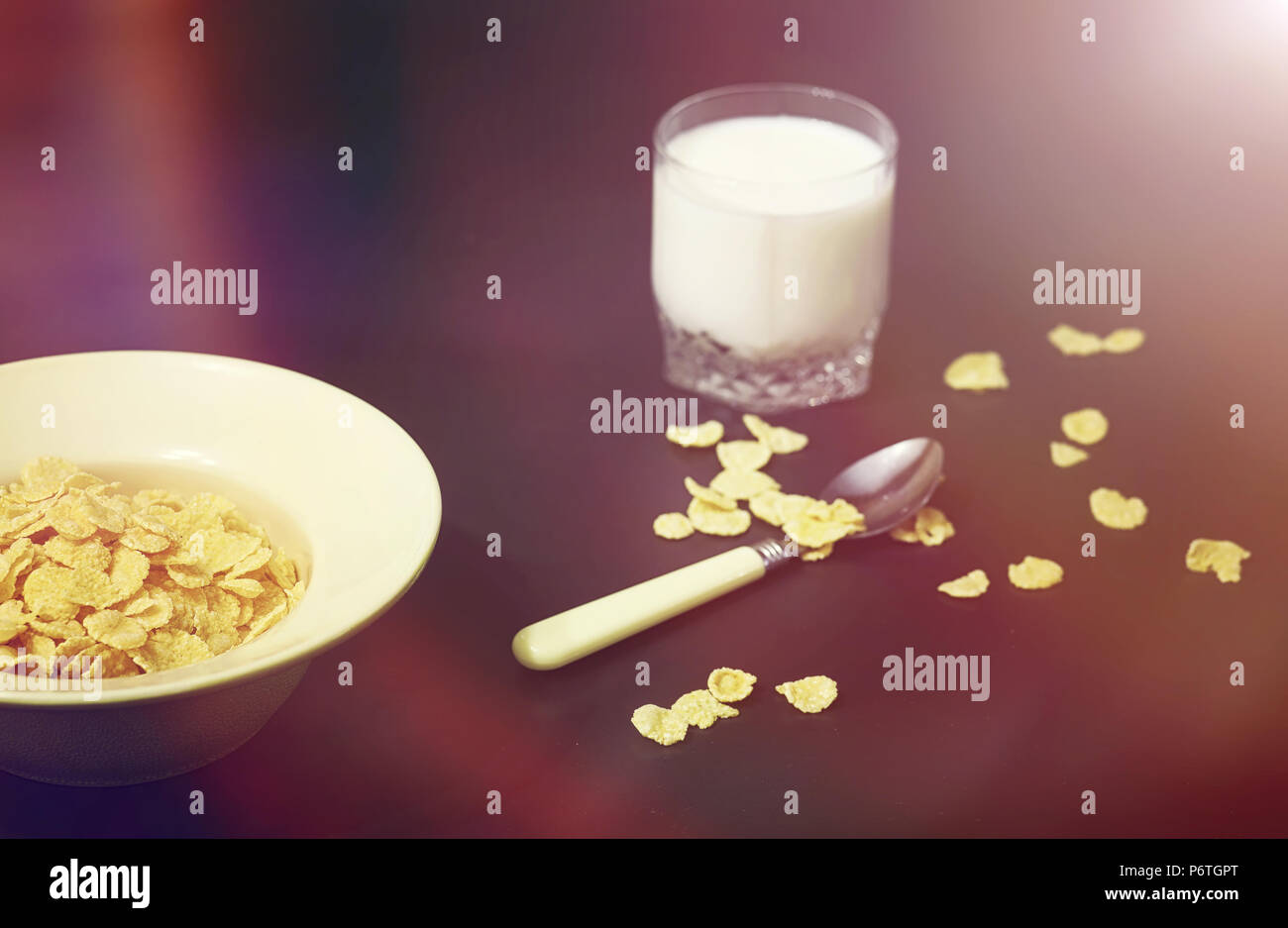 Corn flakes in a plate. Breakfast from flakes with honey and milk. Fast