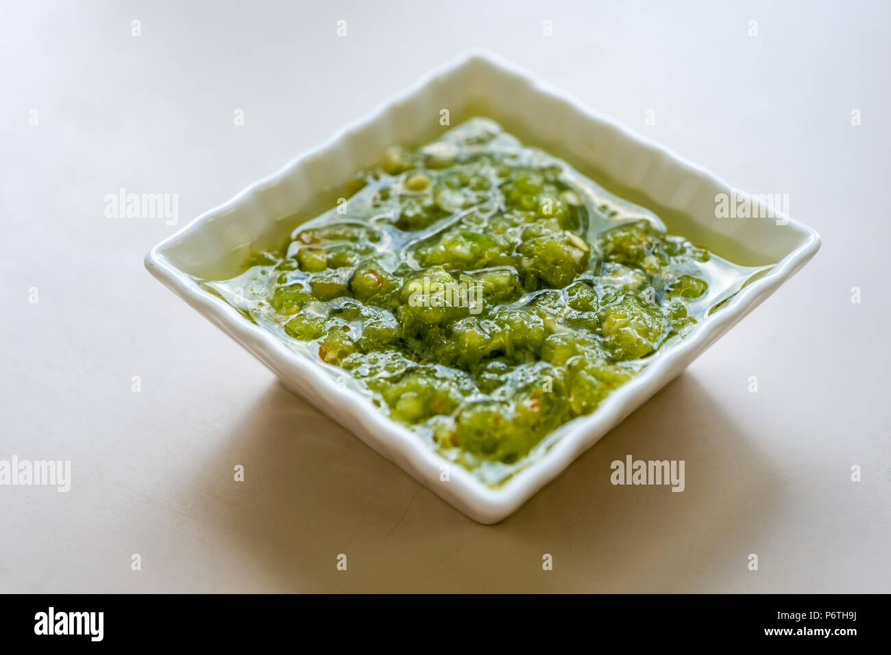 Hot green peppers sauce Stock Photo