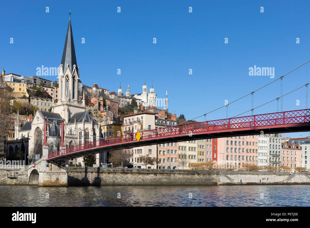 Red suspension bridge connecting old Lyon with the Presqu'ile, Lyon, France Stock Photo