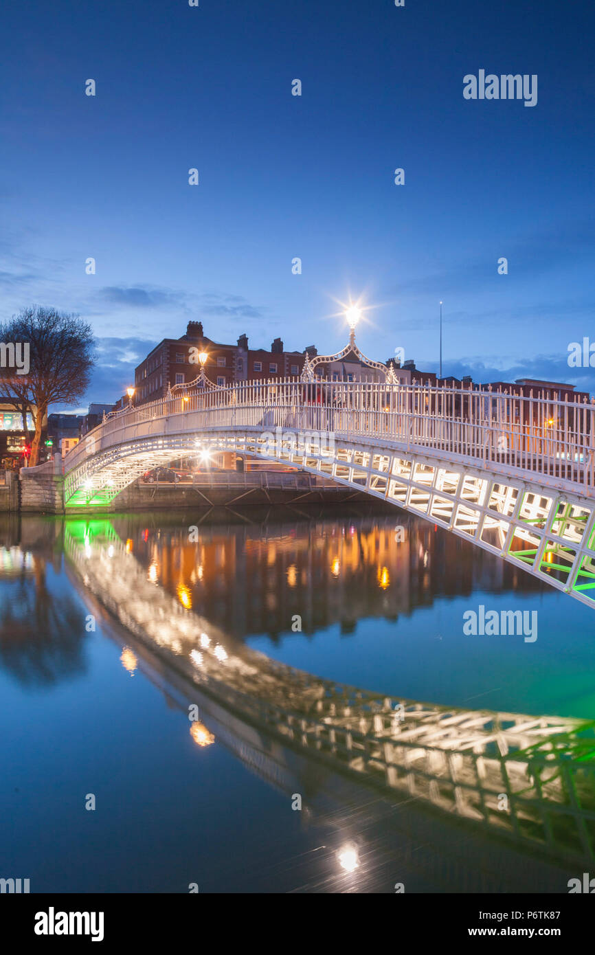 Ireland, Dublin, Hapenny Bridge over the River Liffey, dusk Stock Photo ...