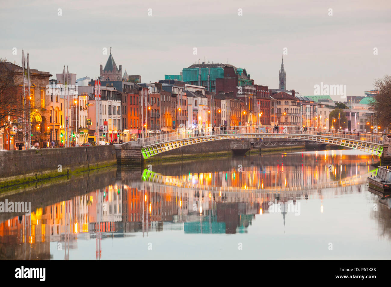 Ireland, Dublin, Hapenny Bridge over the River Liffey, dusk Stock Photo ...