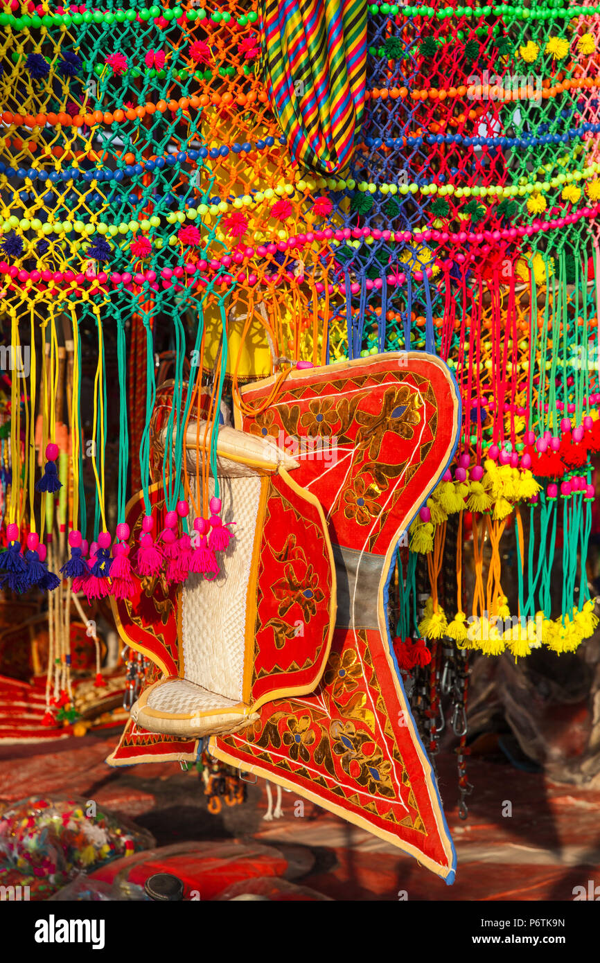India, Rajasthan., Pushkar, Stall selling camel decorations and embellishments at Pushkar Camel Fair Stock Photo