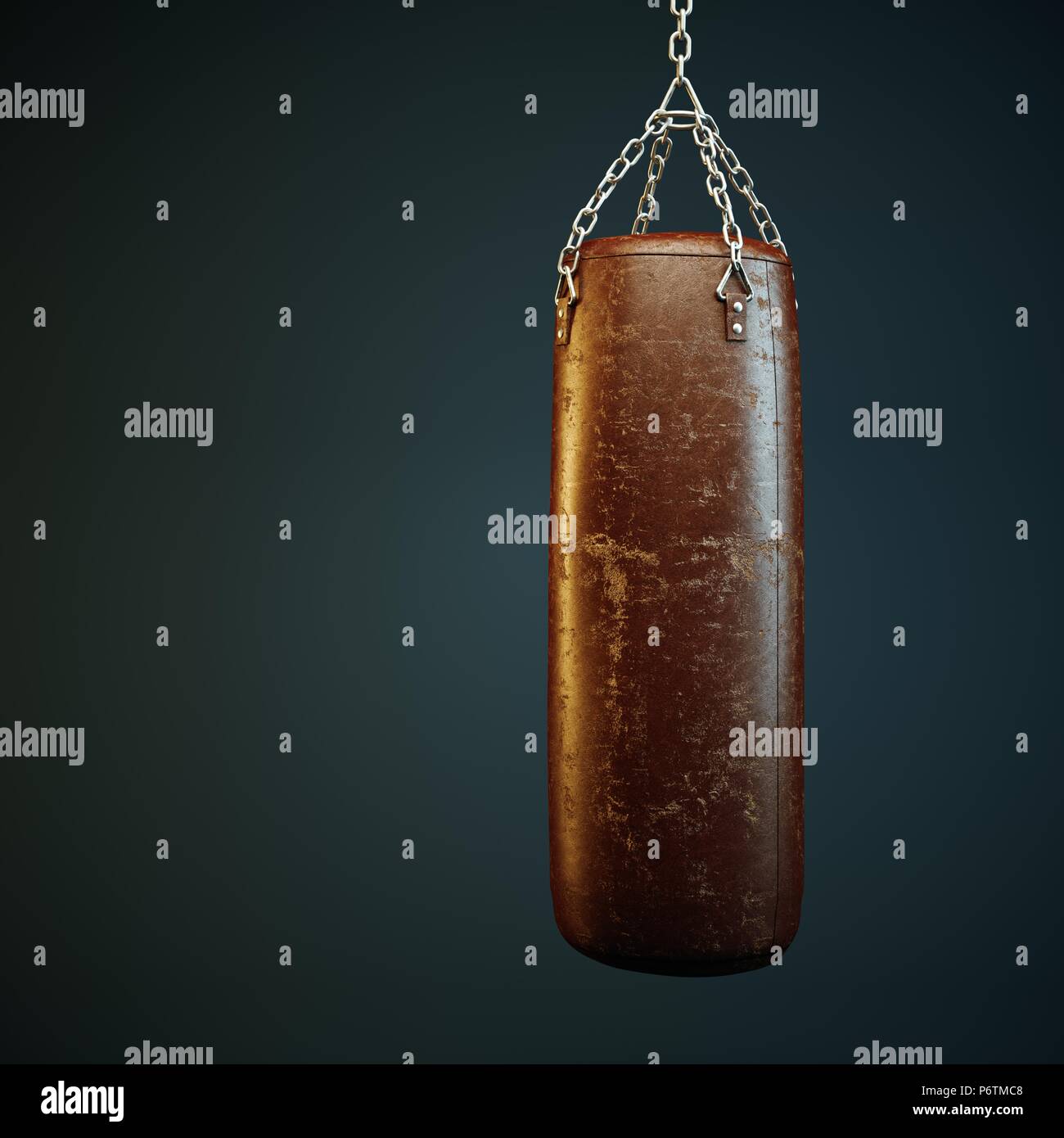 Brown leather punching bag in empty room Stock Photo Alamy