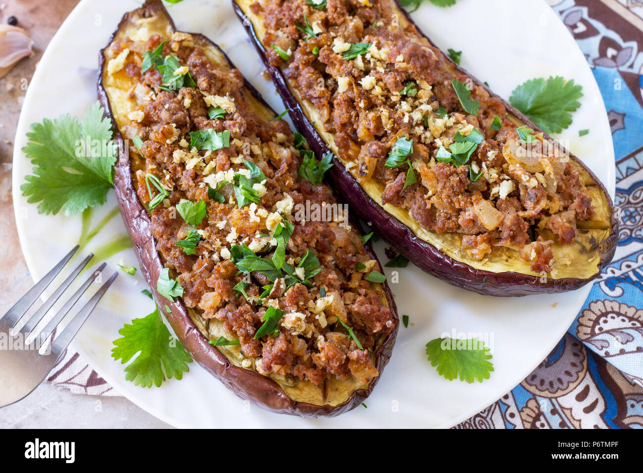 Baked eggplants with meat, walnut and vegetables. Traditional middle