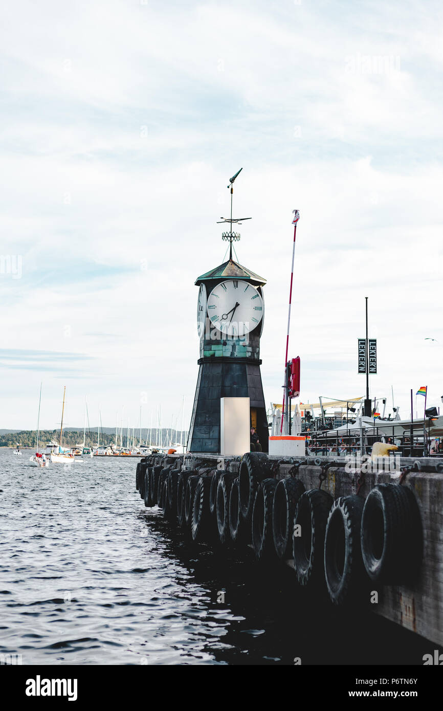 Big clock on the norwegian harbour, Oslo Stock Photo Alamy
