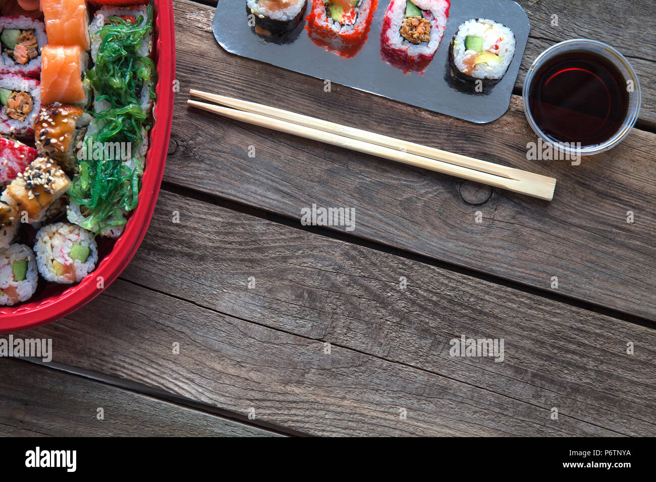 Sushi on a old wooden table background with a decoration Stock Photo