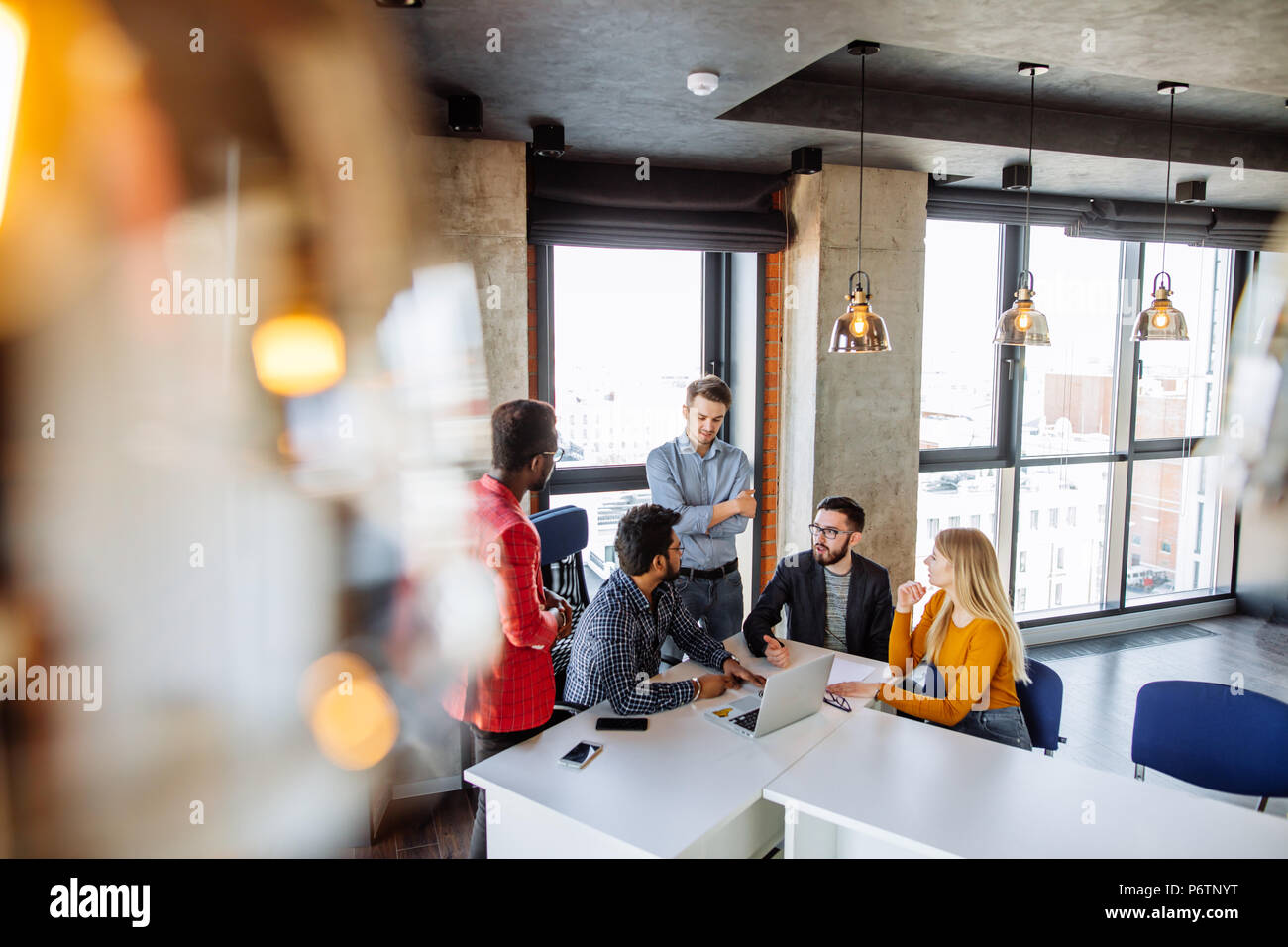 Big company Top managers attending business session of a professional coach trainer at big studio interior Stock Photo