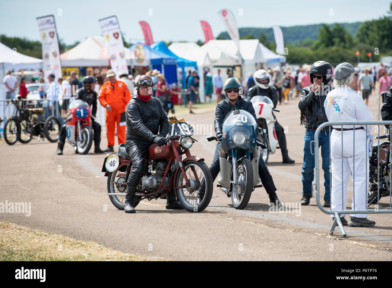 Man and woman riding vintage motorcycles at the flywheel festival. Bicester Heritage Centre. Oxfordshire, England. Stock Photo