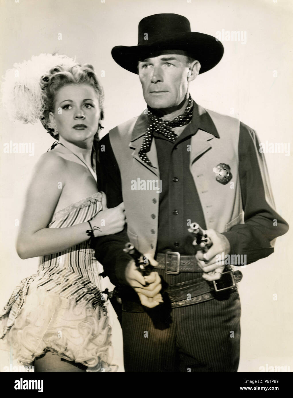 American actors Randolph Scott and Anne Jeffreys in the movie Trail Street, 1947 Stock Photo