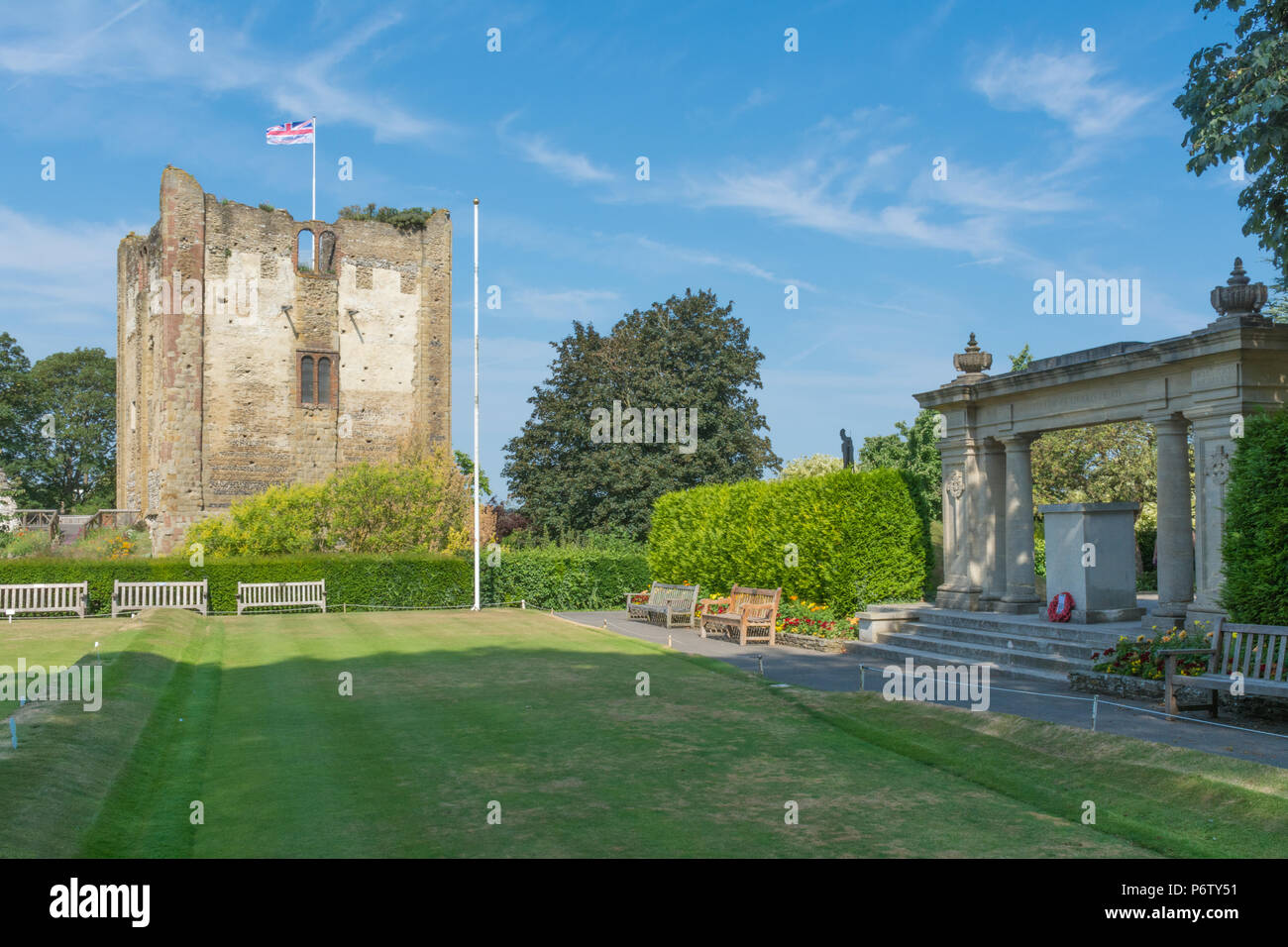 The castle grounds in Guildford, Surrey, UK on a sunny summer day, with the castle keep, bowling green and war memorial arch Stock Photo