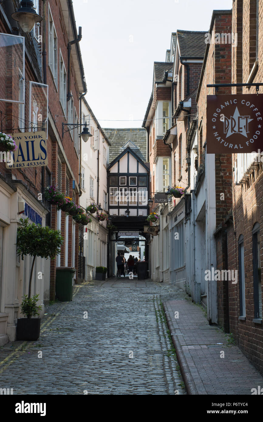 The Angel Hotel courtyard and narrow cobbled street off the high street in Guildford town centre, Surrey, UK Stock Photo