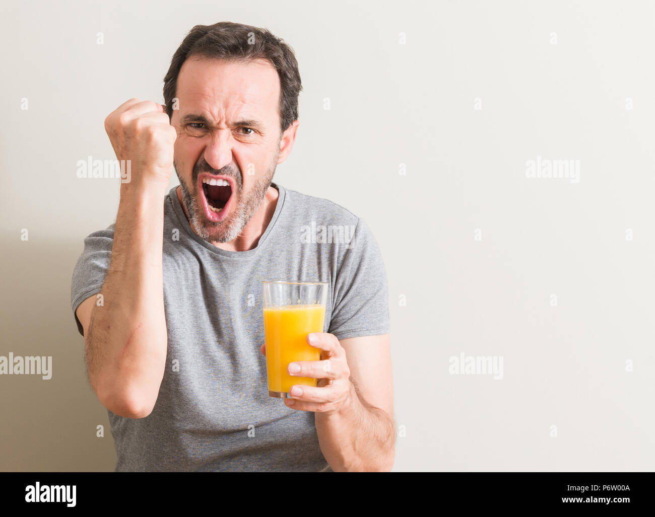 Senior Man Drinking Orange Juice High Resolution Stock Photography And Images Alamy