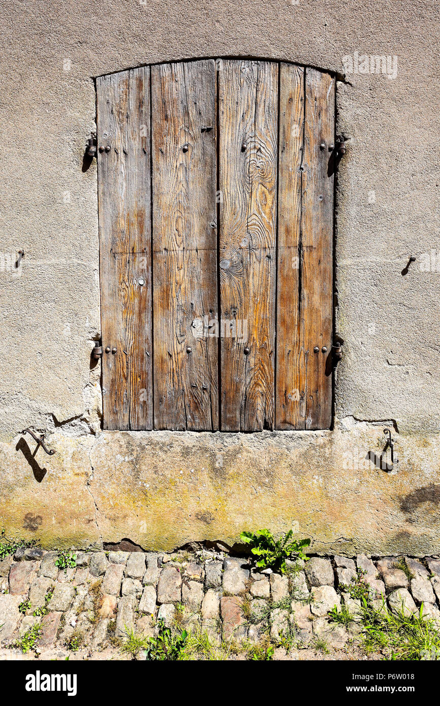 weathered old brown french shutters Stock Photo - Alamy