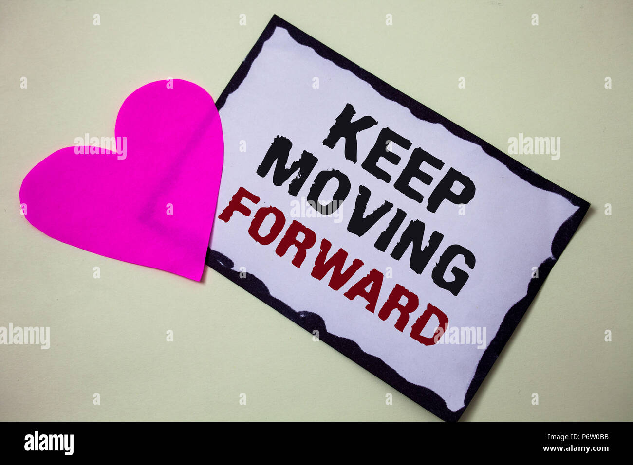 Text sign showing Keep Moving Forward. Conceptual photo improvement Career encouraging Go ahead be better Hart love pink white background love lovely  Stock Photo