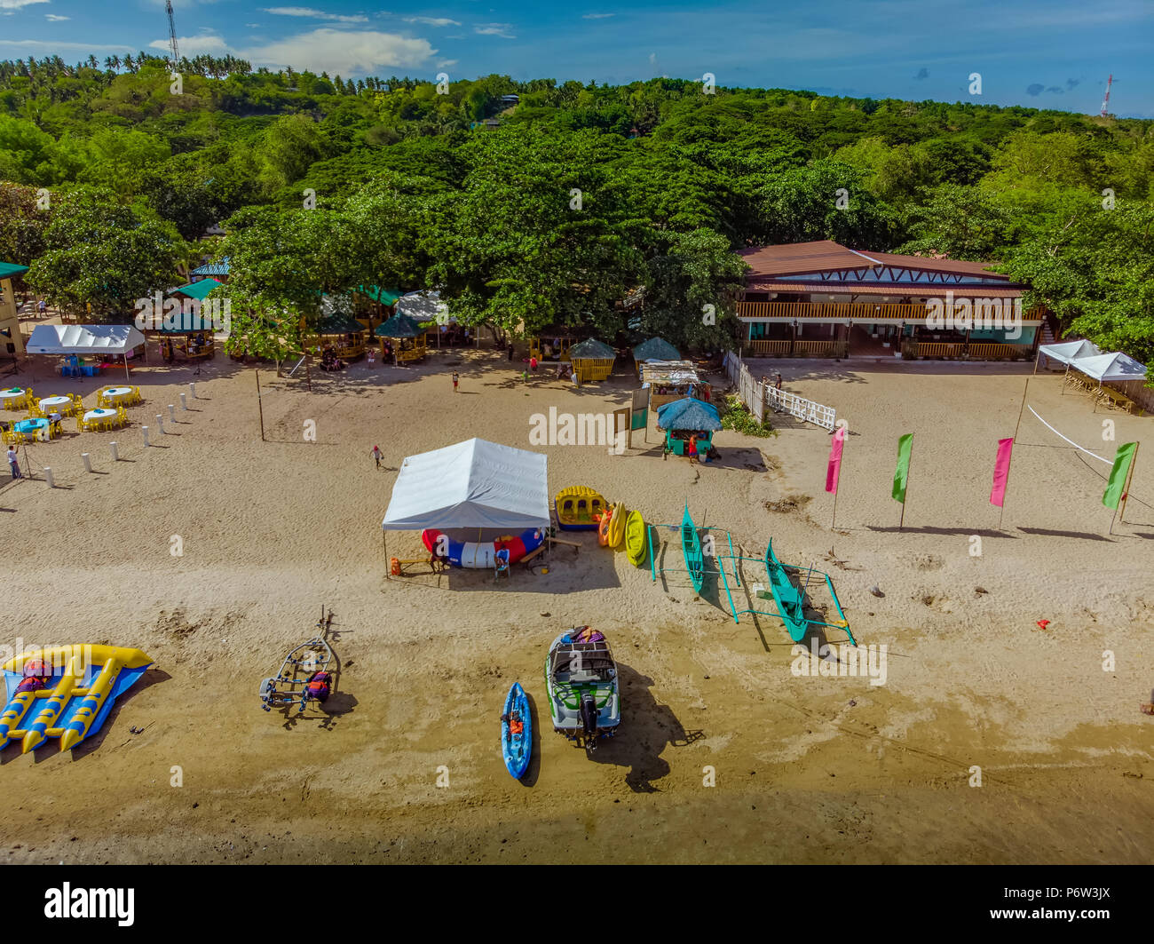 Afternoon aerial view of a beach in Laiya, Batangas with the recreational boats parked in front Stock Photo
