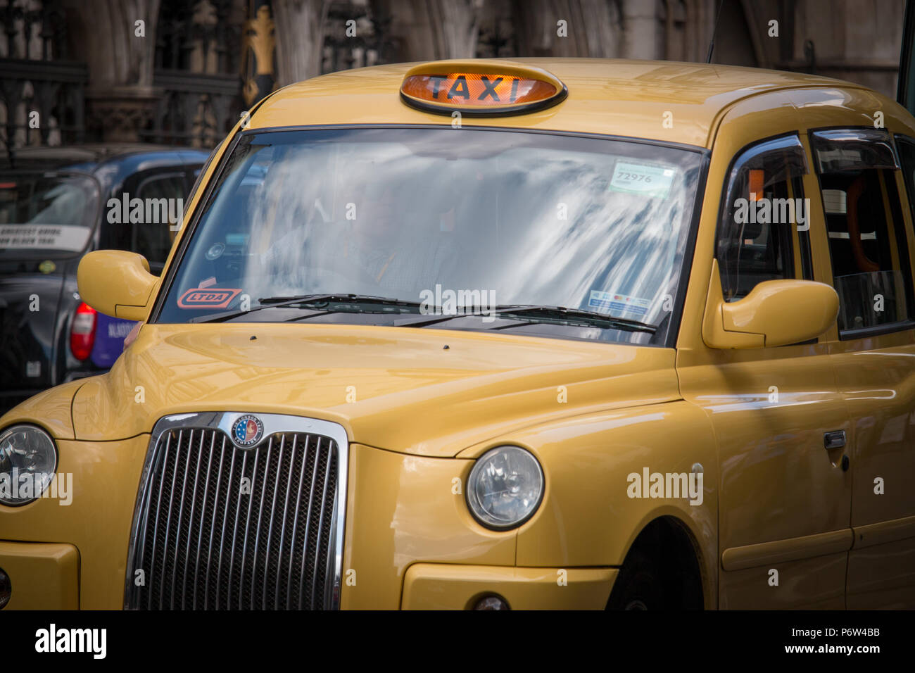 A Bright Yellow Taxi In London Near The Inns Of Court Stock Photo Alamy A Bright Yellow Taxi In London Near The Inns Of Court Stock Photo Alamy